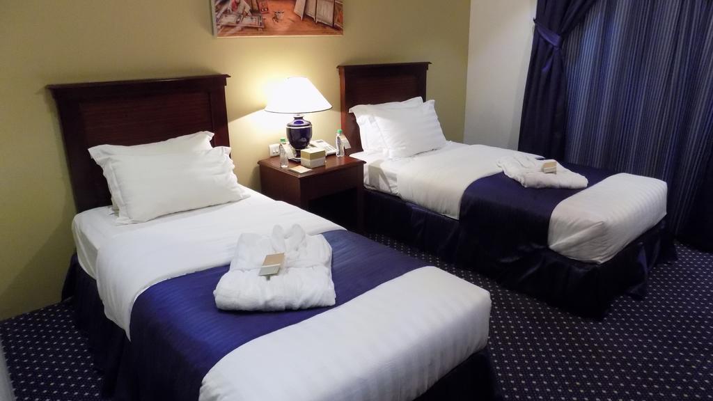 Onizah Hotel Unaizah Quarto foto